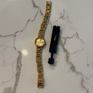 Gold and green watch
